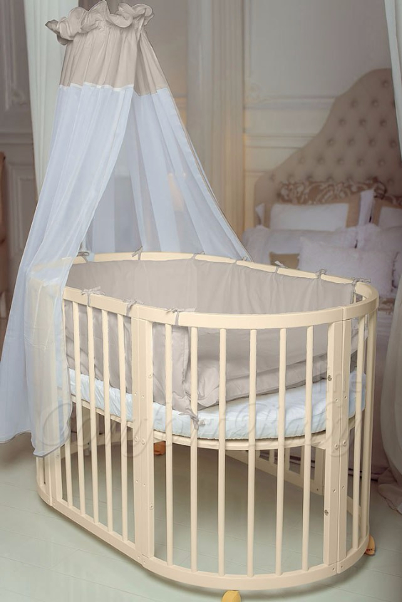 КРОВАТКА- ТРАНСФОРМЕР "COMFORT BABY" .Цена: 25 000 руб.  ХАРАКТЕРИСТИКИ:  возраст детей: 0-5 лет  габариты модели (Д х Ш х В): 1) колыбельки: 78*76*81 см  2) овальной кроватки: 128*76*81 cм  матрас приобретается отдельно.  максимальная нагрузка: 120 кг  Материал: изготавливается только из настоящего массива бука высшего сорта.  сборка: кровать в разобранном виде, простота сборки, инструкция по сборке на русском языке  продукция сертифицирована  производство: Россия  гарантия: 2 года   Дополнительные характеристики: 4 положения по высоте (расстояние положения дна от пола без колес: 1см, 12см, 37см, 57см; расстояние между отверстиями снизу-наверх: 12см, 15см, 20см.); 3 прутика - съемные.  КОНМПЛЕКТАЦИЯ:  1-я ступень - круглая кроватка  2-я ступень - овальная кроватка  3-я ступень - диванчик  4-я ступень - манеж  5-я и 6-я ступени - 2 кресла и столик  7-я ступень - пеленальный столик  ДОПОЛНИТЕЛЬНЫЕ ОПЦИИ:  Комплект постельный "Classic" +6950 руб.  Комплект постельный "Colorit" + 11990 руб.  Фирменный держатель для балдахина +790 руб.  Комплект цельных матрасов " Холкон"/ "Кокос" (круглый+овальный) +8490 руб  Маятник "ComfortBaby Pendulum" 2 в 1+6990 руб.